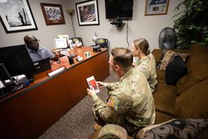 Students discussing with a counselor in an office