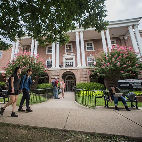 Students walk by Harned hall