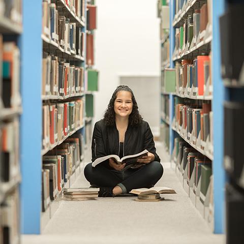 Natalie Castillo sits in library