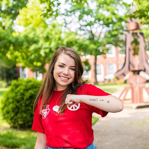 Social work major, Mallory Fundora, standing outside