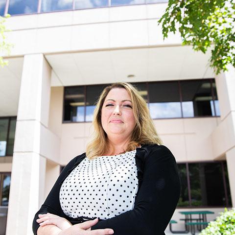 Diana Estes in front of a building 